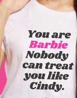 BARBIE White Y Day Apparel T-shirt with fun affirmation foodie slogan on the front: You are Barbie Nobody can treat you like Cindy in ORANGE font. It’s celebrates self worthiness. Available to Purchase from Y Day Apparel.com