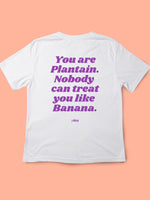 White Y Day Apparel T-shirt with slogan on the back: You are plantain. Nobody can treat you like Banana., in Purple font. Available to Purchase from Y Day Apparel.com